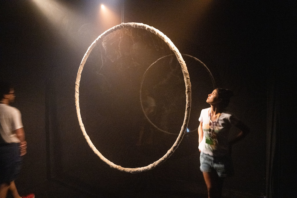 Visitors exploring the suspended rings of the Australian ECR installation